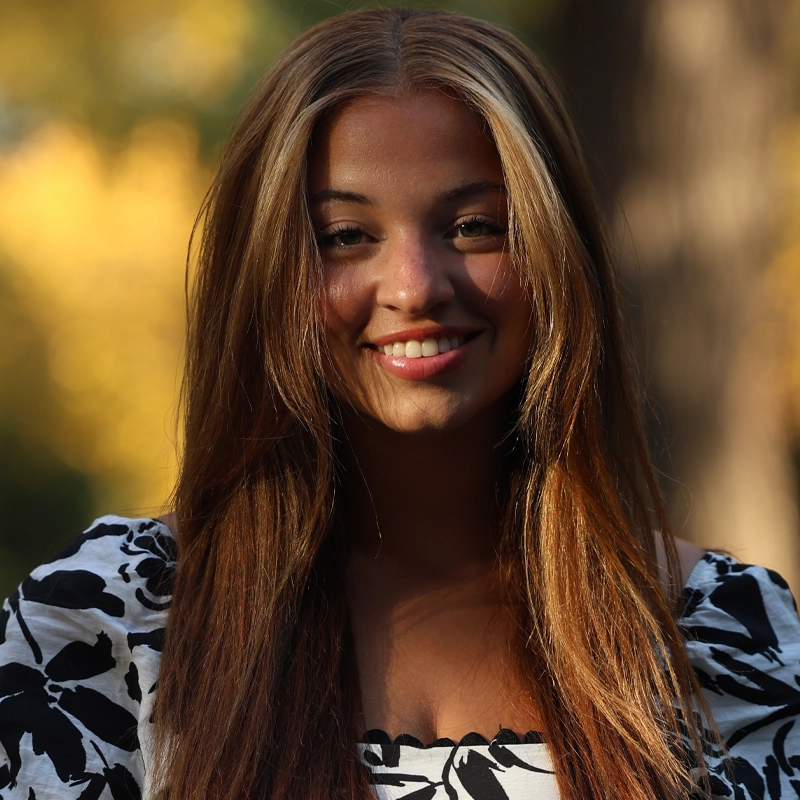 Hannah Crocker, a woman smiling at the camera.