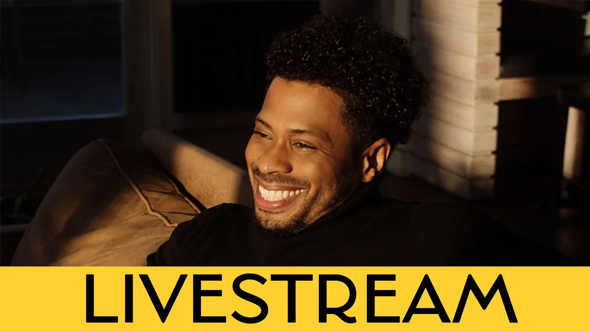 Chester Gregory, with his signature black hair, smiles warmly during a special Black on Broadway livestream event.
