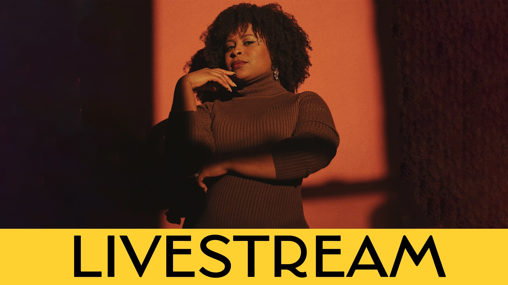 A woman in a brown turtleneck dress stands confidently with one hand on her chin against a warm orange-red background. Bold yellow banner at the bottom displays 