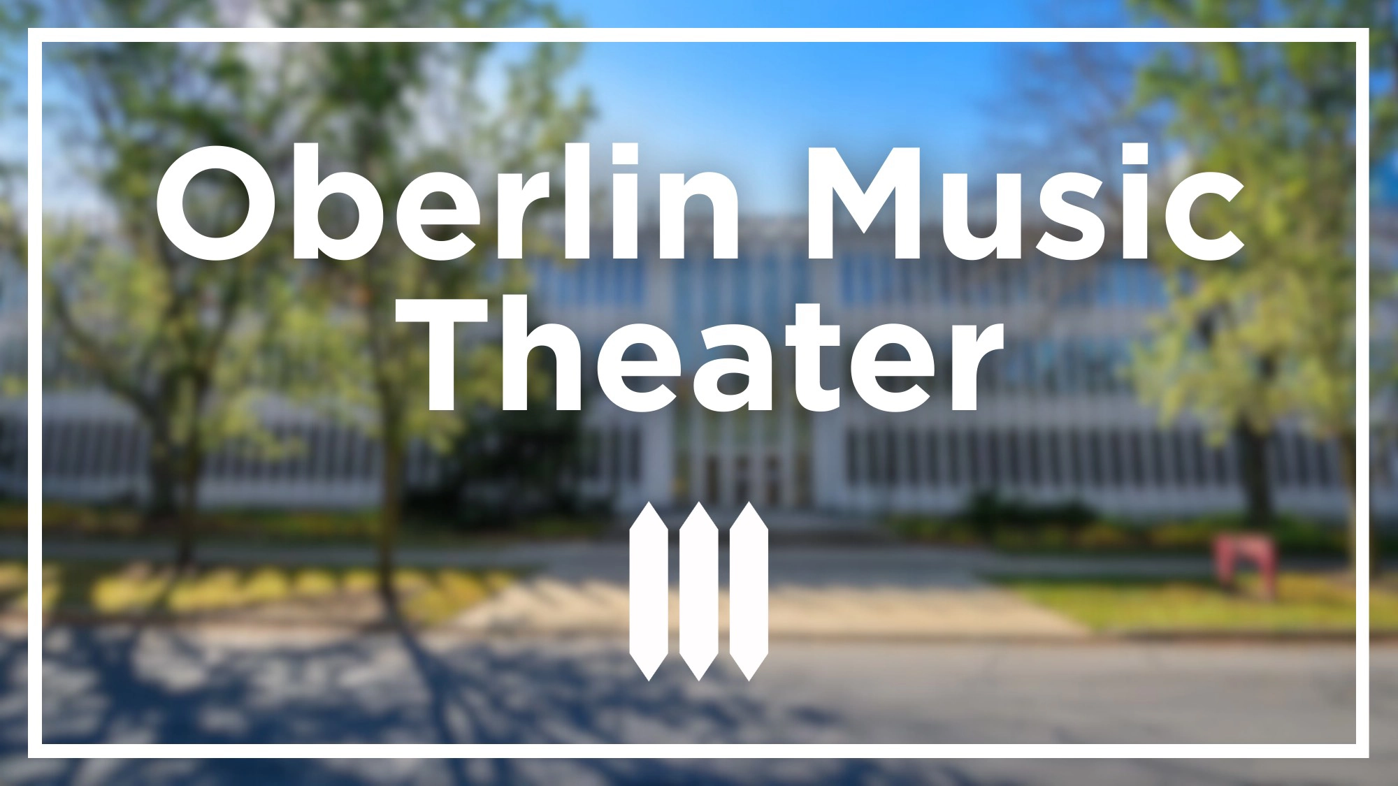 A blurred image of a modern building with large windows is overlaid with bold white text reading 