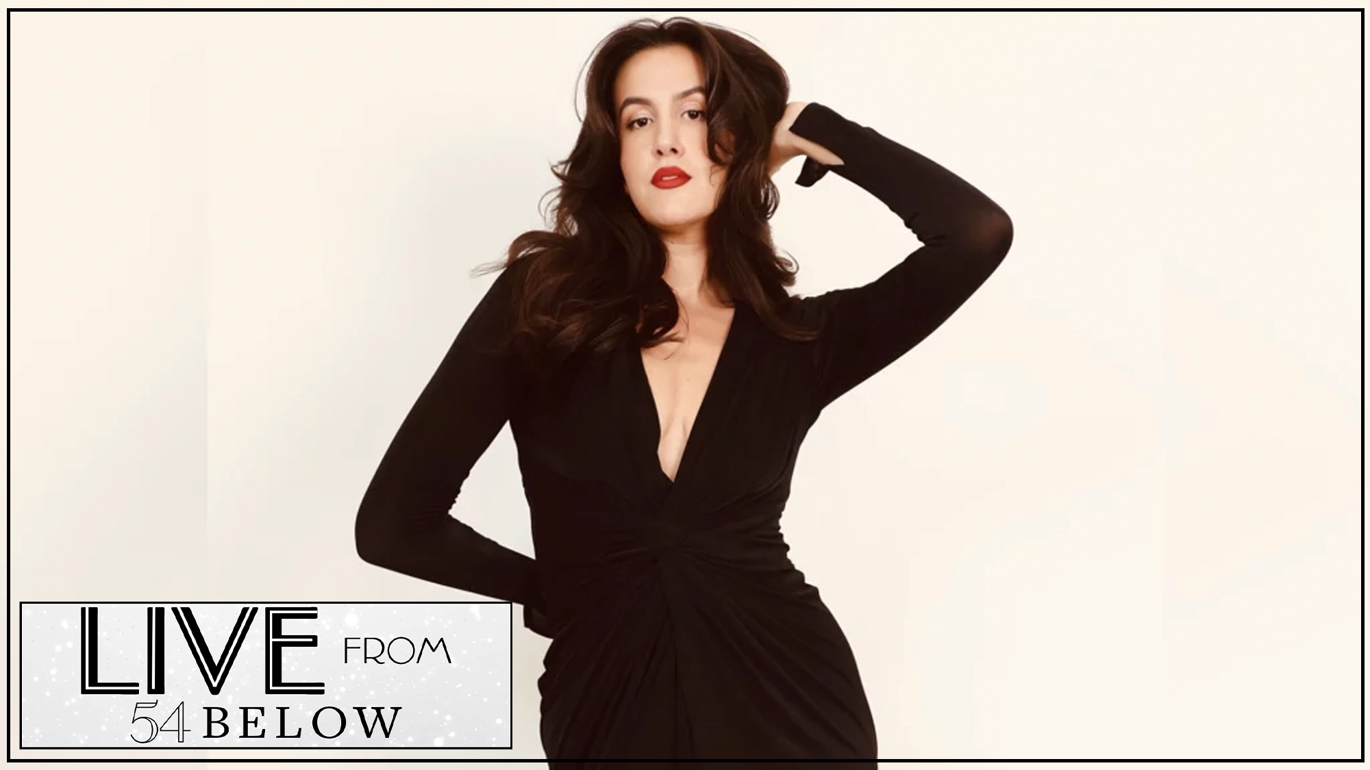 Ava Locknar show page Ava Locknar, a modern bombshell with long brown hair and red lipstick, poses confidently in a fitted black dress with a deep V-neck. The