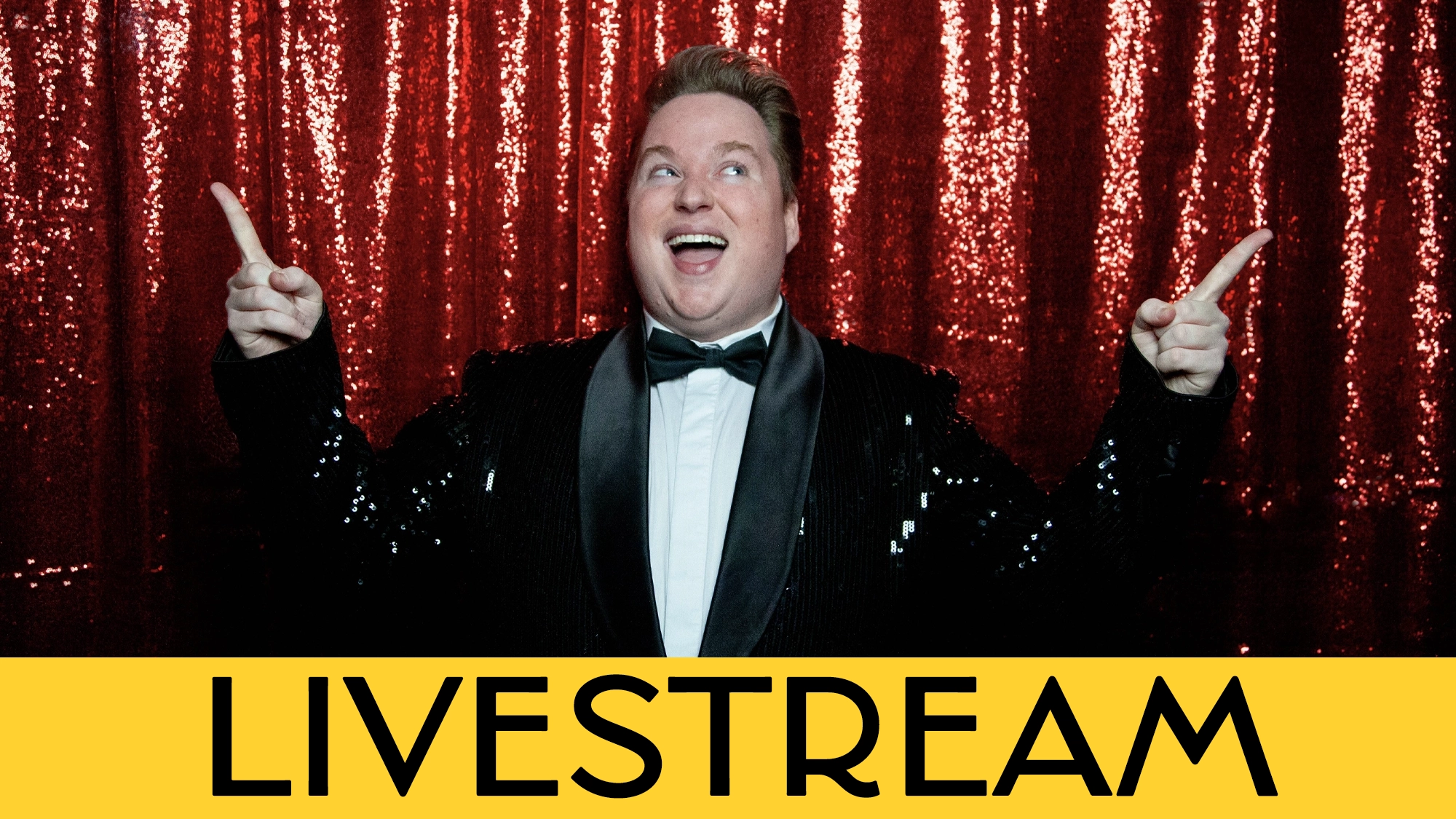 LIVE - Macon Prickett Calendar A person in a black sequin jacket and bow tie smiles broadly and points both index fingers upward. Behind them is a sparkly red curtain. A bold yellow banner at the bottom reads “LIVESTREAM”—it’s Macon Prickett’s dazzling comeback!.