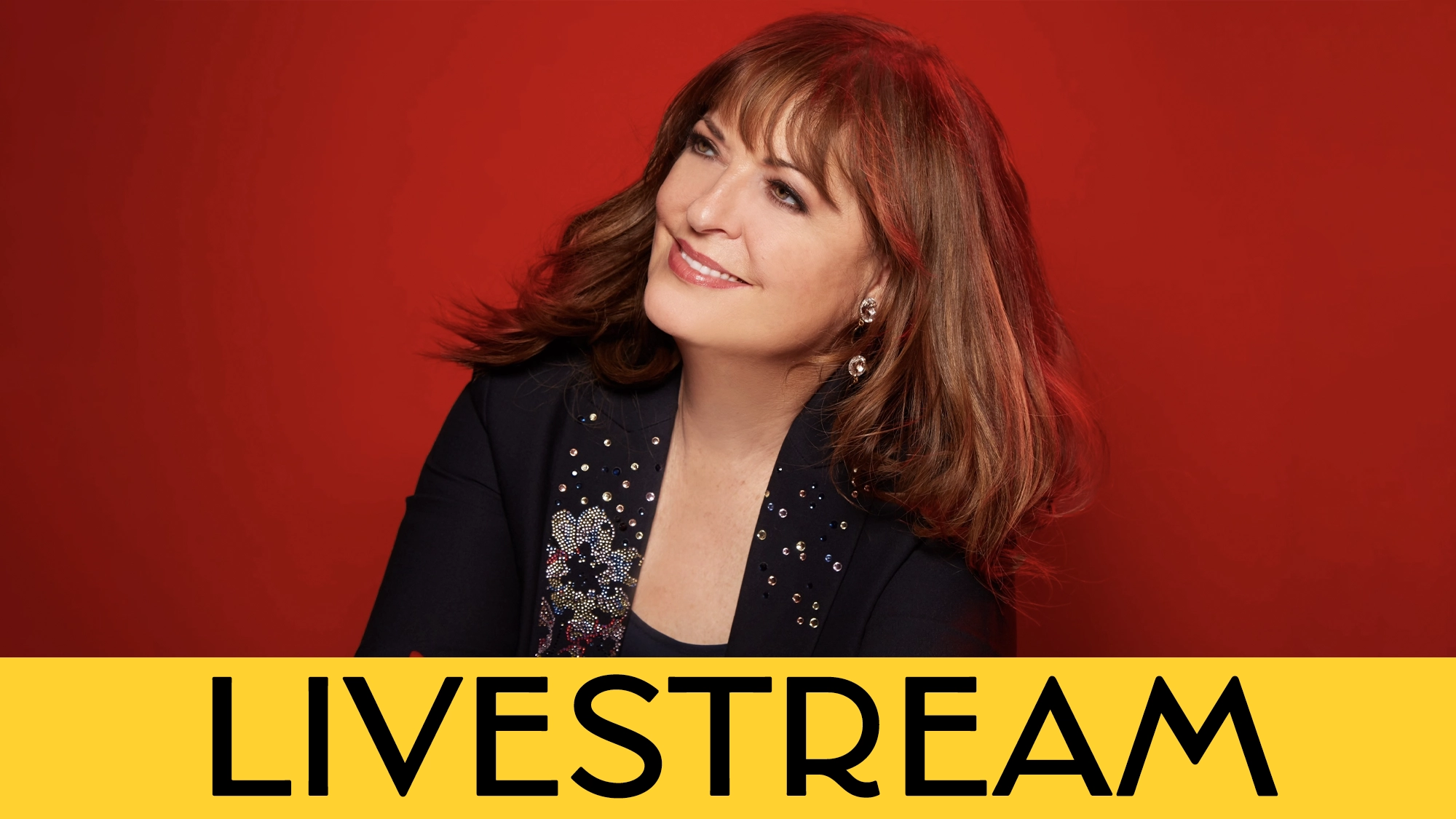 A woman with brown hair and bangs smiles, looking slightly upward. She wears a black jacket with sparkling details. The bright red background pops behind a bold yellow banner reading 