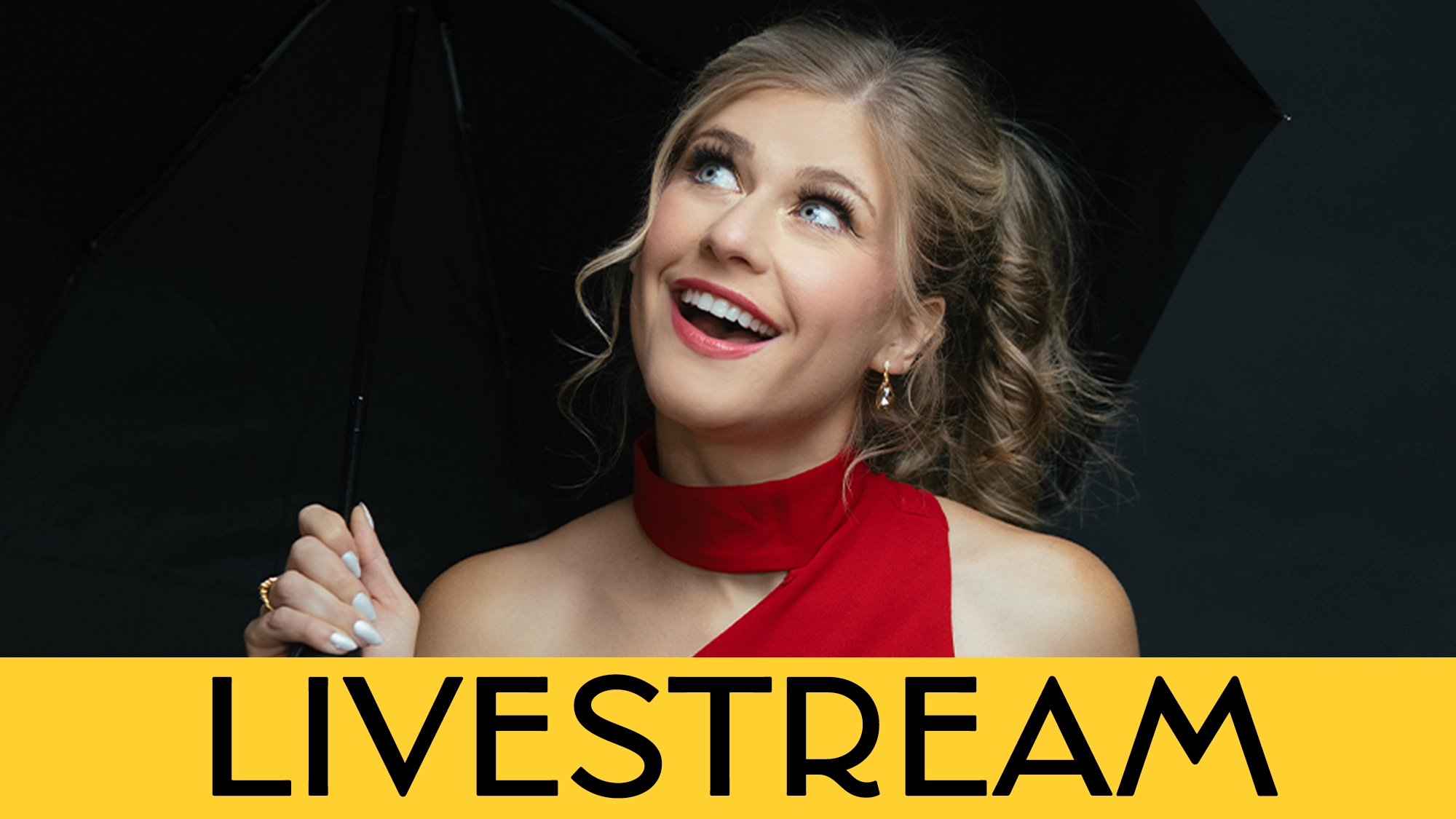 A smiling woman in a red dress holds a black umbrella against a dark background, gazing upward. A bright yellow banner at the bottom reads 