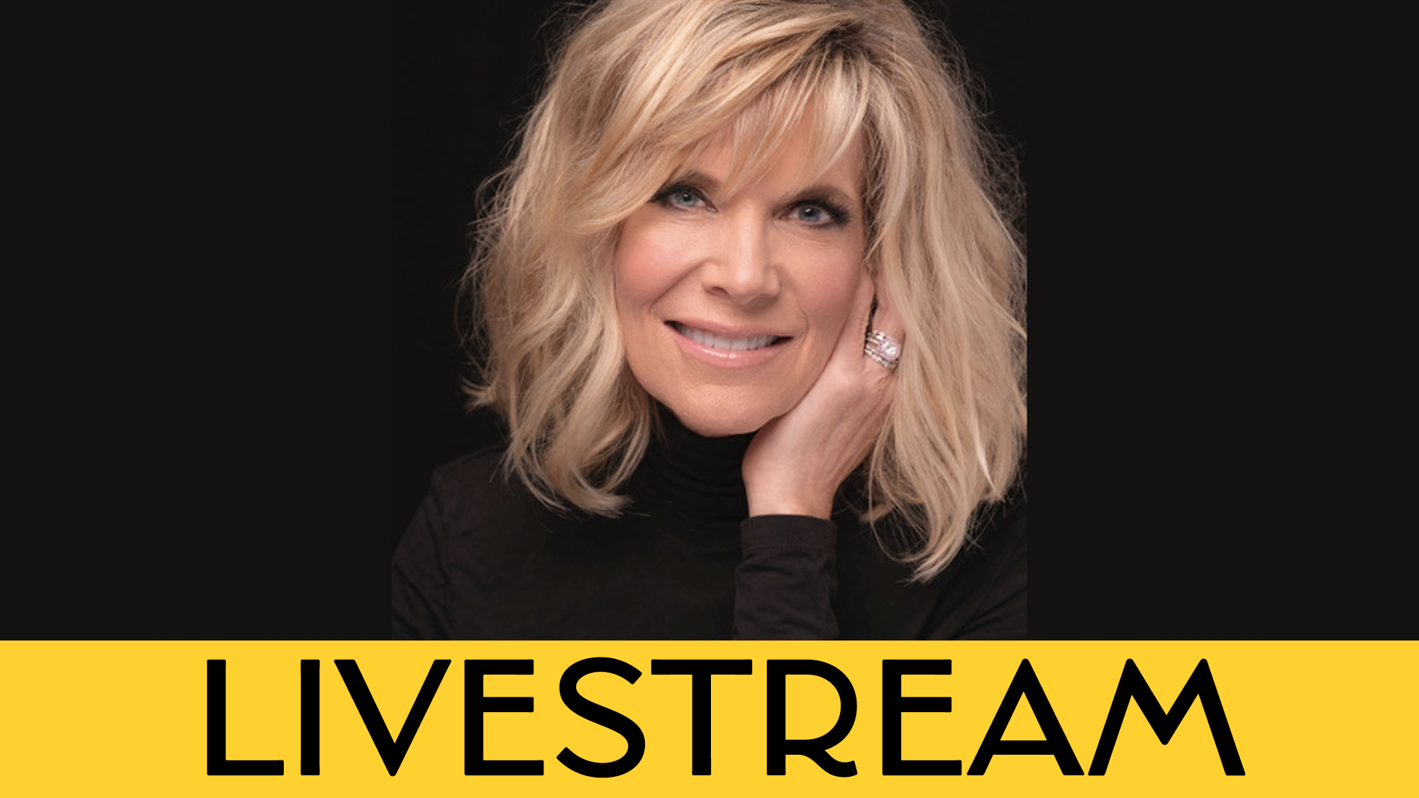 A woman with shoulder-length blonde hair and a black top smiles warmly, resting her hand on her cheek. The background is black. At the bottom, a yellow banner displays 