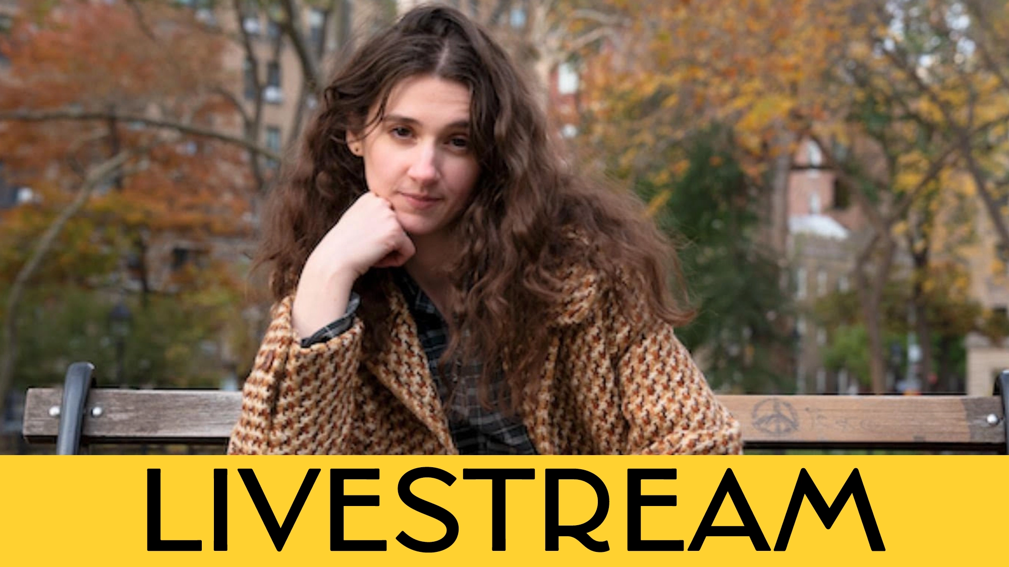 A person with long brown hair and a brown-patterned coat sits on a park bench, resting their chin on their hand. Autumn trees are in the background. “LIVESTREAM” and Schuyler Iona Press appear in bold black letters on a yellow banner at the bottom.