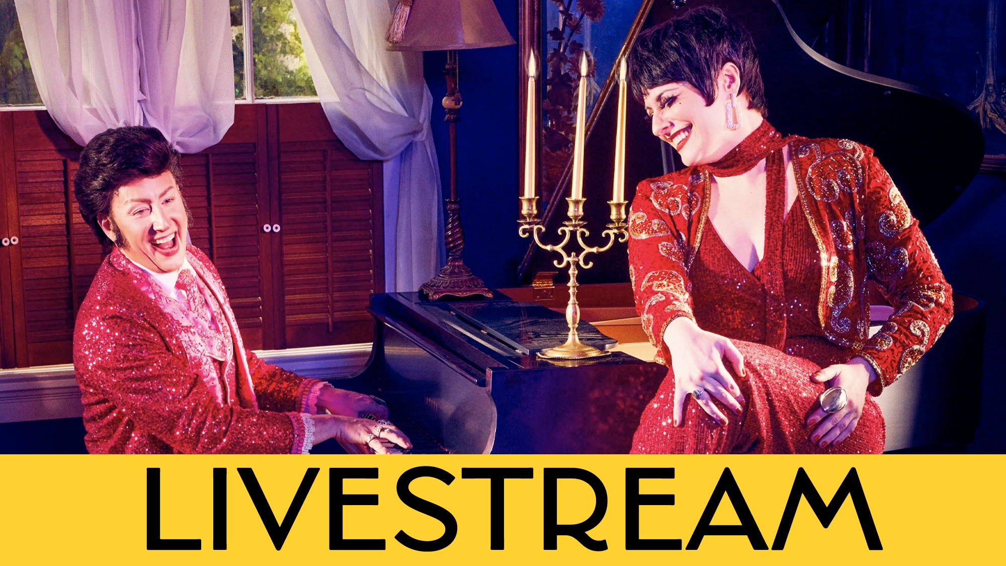 LIVE Liberace & Liza Cal Two performers in sparkling red outfits pose by a grand piano, evoking a Liberace tribute. One plays piano, smiling, while the other sits atop holding a microphone. A large yellow