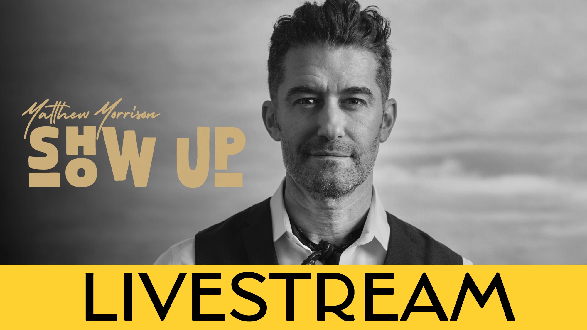 Matthew Morrison calendar image Black-and-white image of Matthew Morrison in a vest and open-collared shirt, slightly smiling, with