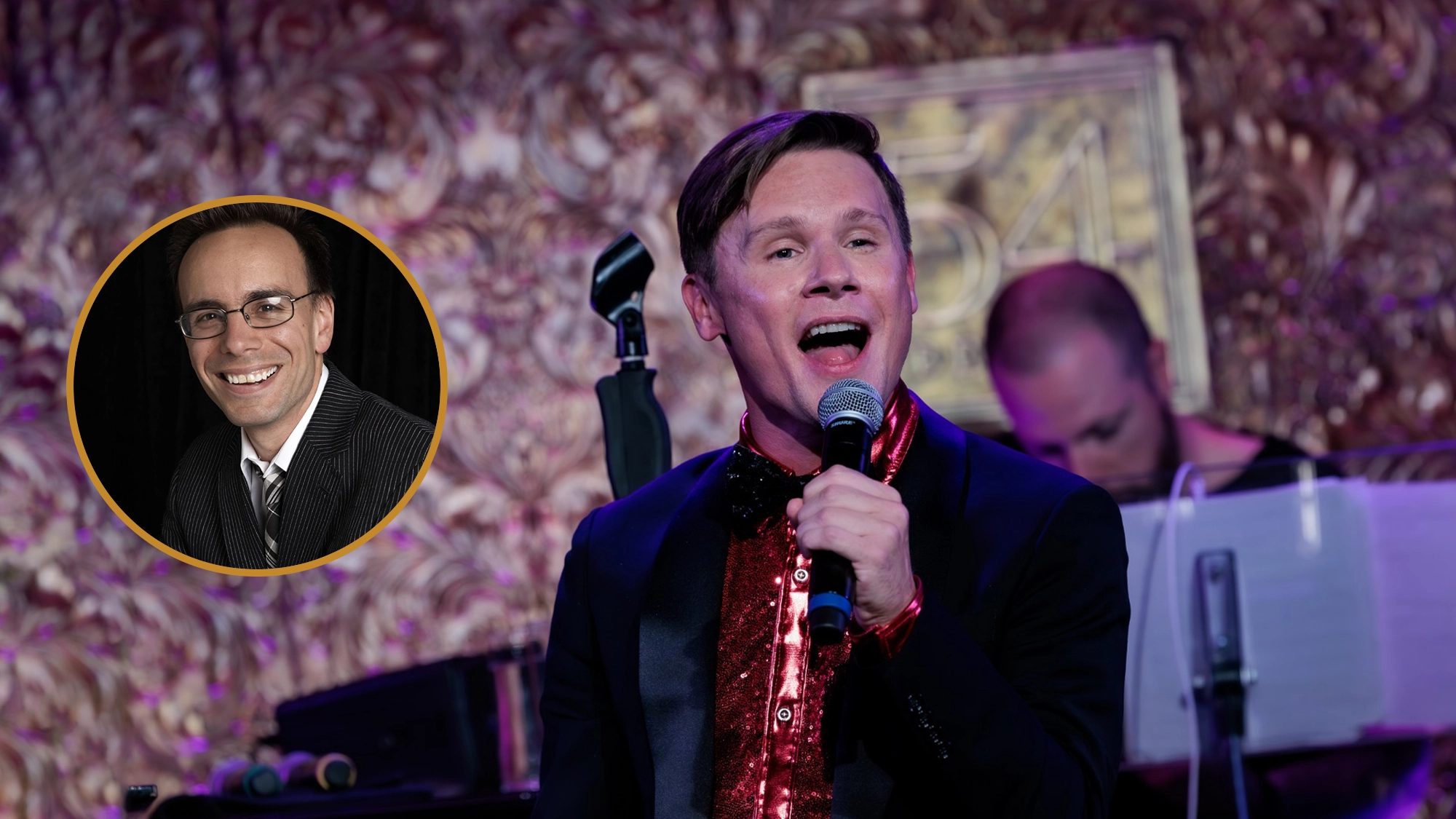A man in a black suit with a red sequined shirt sings into a microphone on stage—possibly performing 