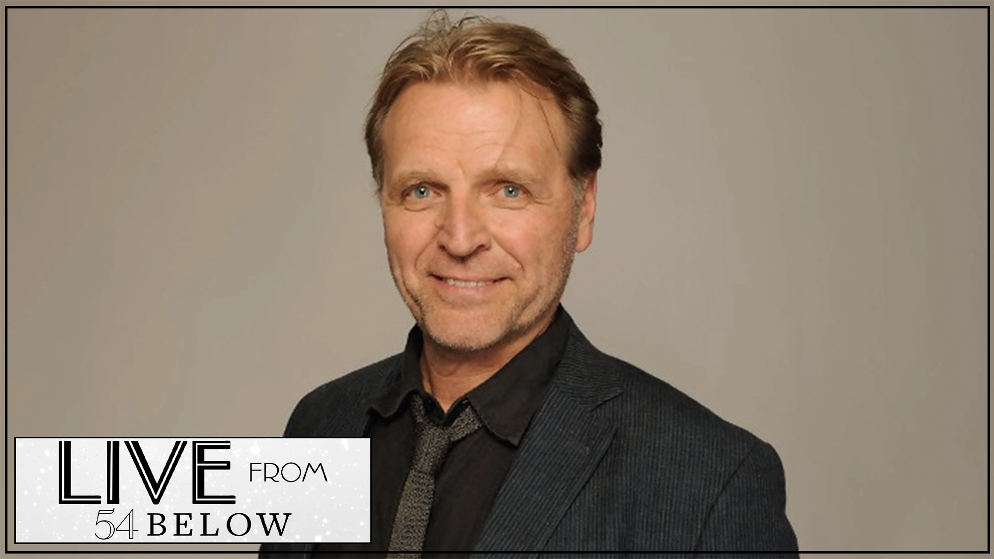 David Rasche show page A man with blond hair and blue eyes smiles at the camera. He wears a dark suit, shirt, and tie. The background is plain beige. In the bottom left corner, there is a logo reading “LIVE FROM 54 BELOW” in a bold, art deco style font.