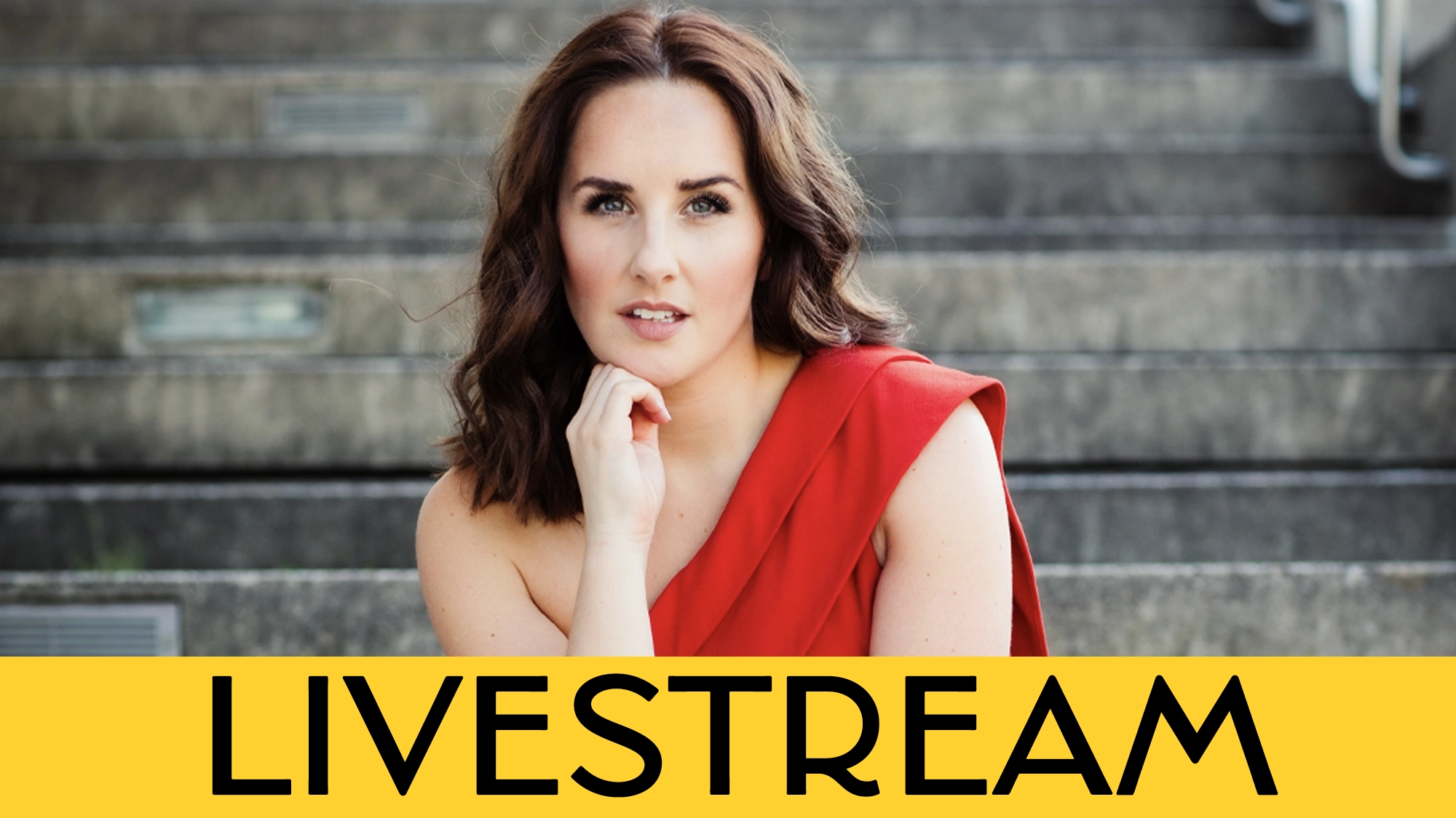 A woman with wavy brown hair poses on outdoor steps, wearing a red one-shoulder dress. She rests her hand on her chin and looks forward, channeling the poise of Jeanna de Waal. A yellow banner at the bottom has the bold black text “LIVESTREAM,” hinting at an upcoming event featuring songs I love to sing.