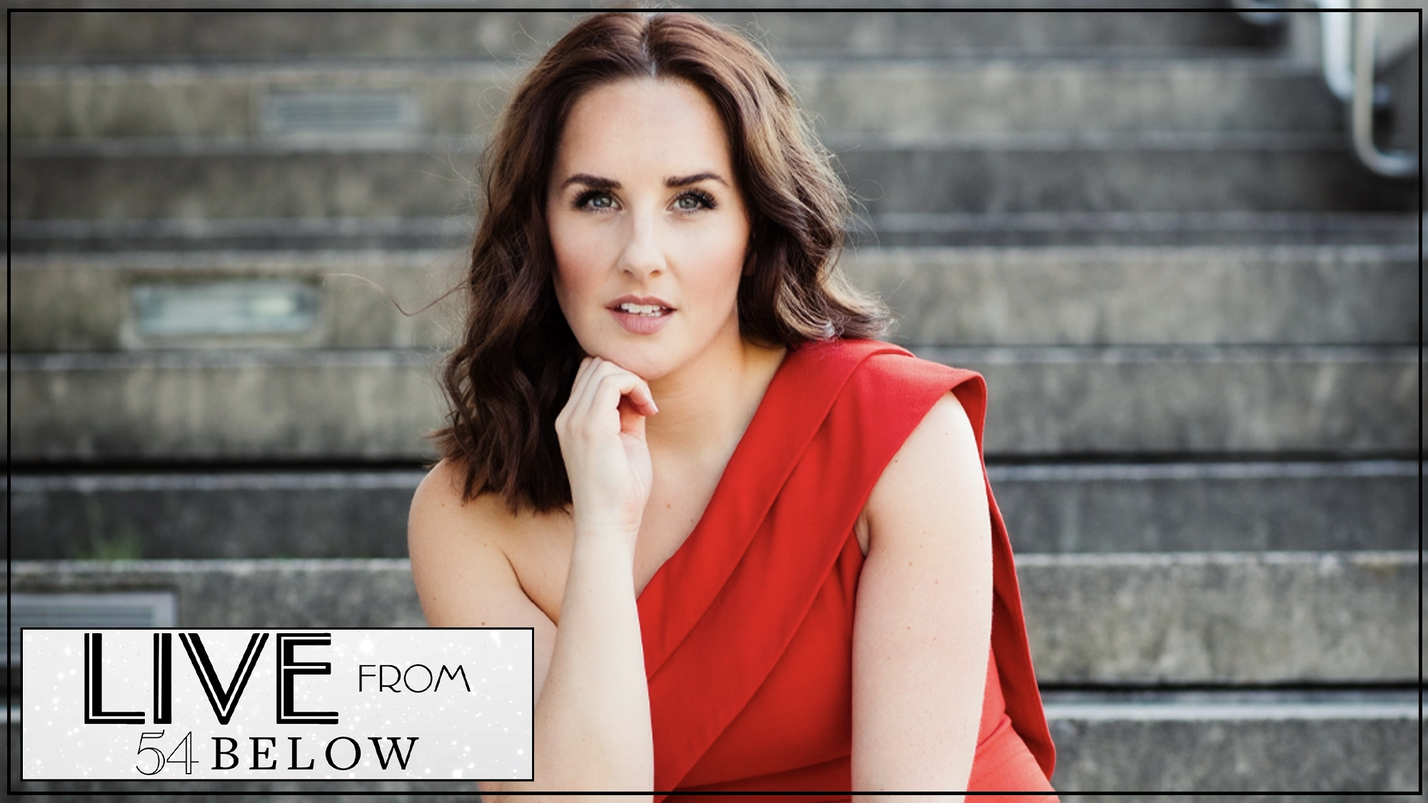 A woman with wavy brown hair, wearing a red one-shoulder dress, sits on outdoor steps, resting her chin on her hand. The lower left corner displays a “LIVE FROM 54 BELOW” logo in black and white, hinting at a special livestream event featuring songs I love to sing by Jeanna de Waal.