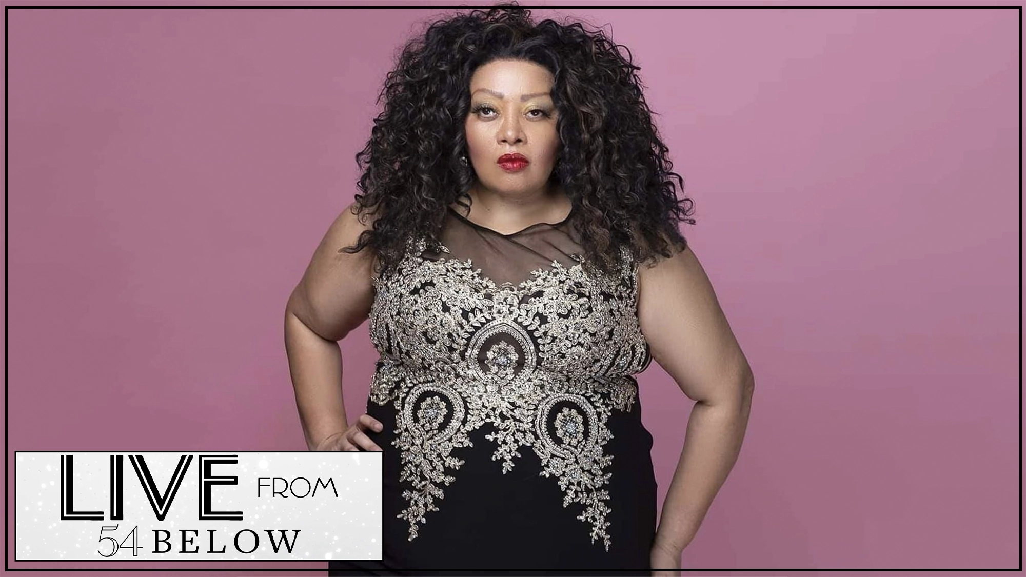 Queen Diva show page A woman with voluminous curly hair stands confidently against a pink background, wearing a black dress with intricate silver embroidery. She has her hand on her hip and a bold red lip. The bottom left corner contains the “LIVE from 54 BELOW” logo.