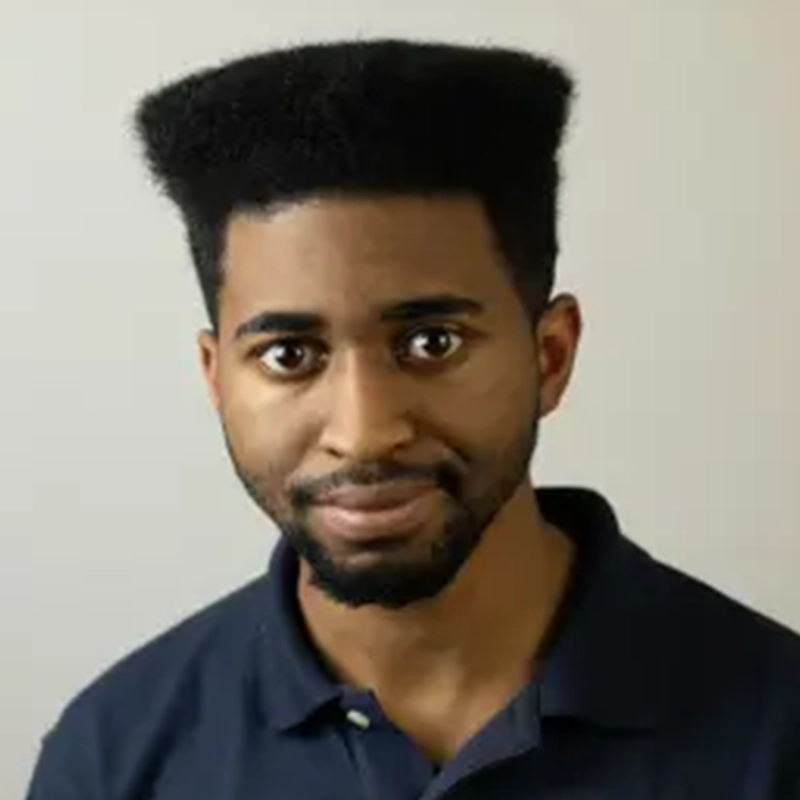 Tyler Cirulnick is a young man with a high-top fade hairstyle and a short beard, wearing a dark blue collared polo shirt.